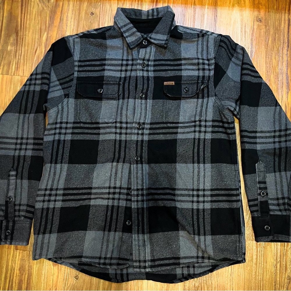 Orvis flannel shirt. Size Small. Shoes and pants not included.